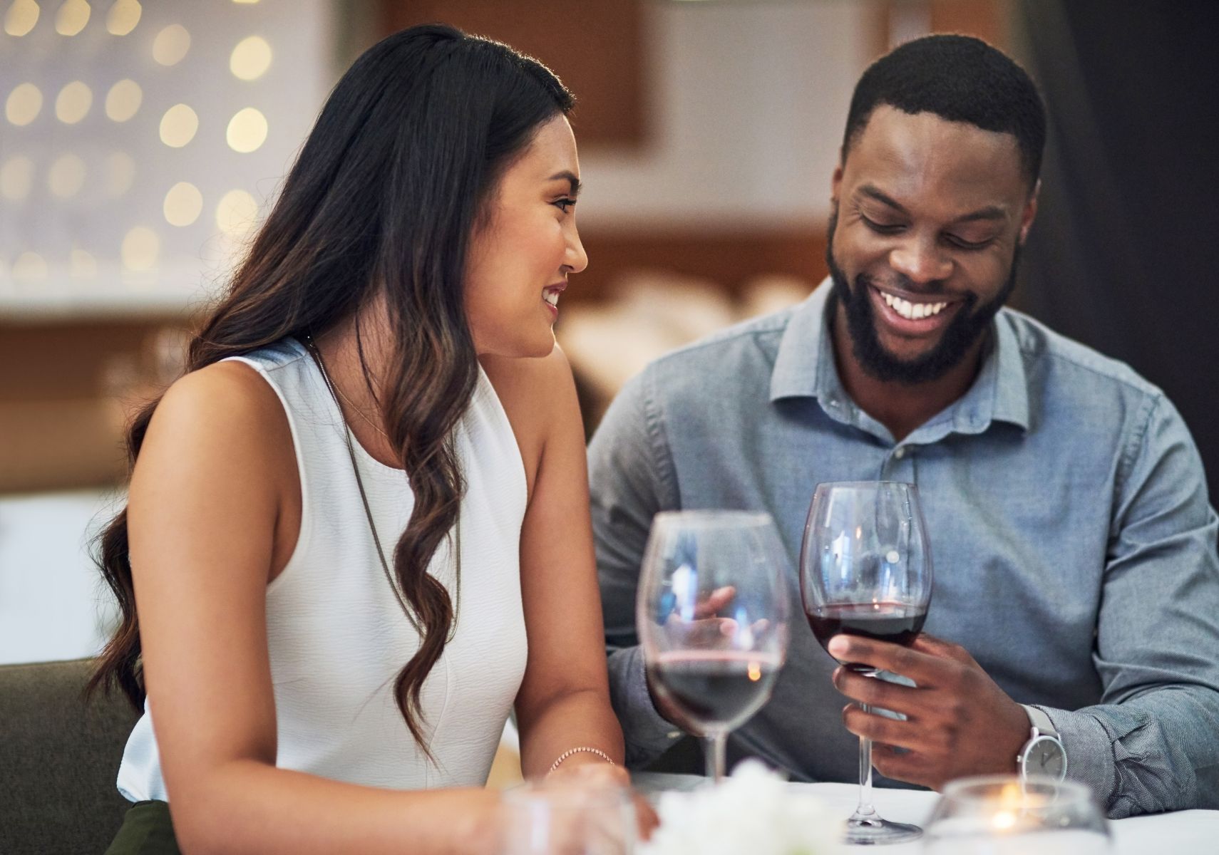 a couple having wine on a date in Fort Walton Beach